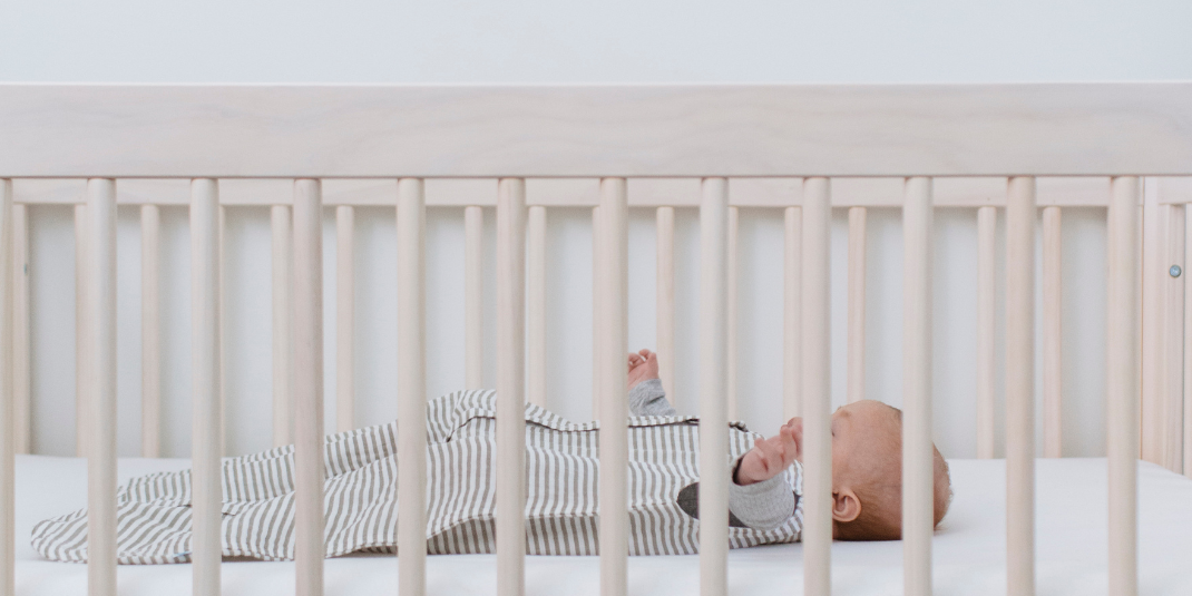 How can I get my baby to sleep in the cot?